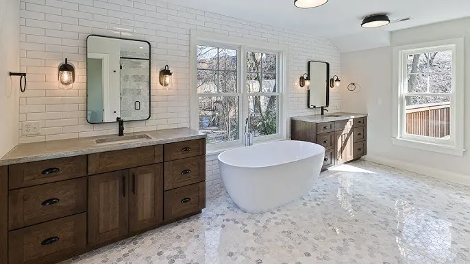 Luxurious master bathroom with dark wood double vanity, white subway tile walls, and a freestanding soaking tub.